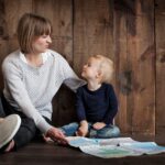 Child With Woman Holding Map