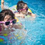 2 Girl's Swimming during Daytime